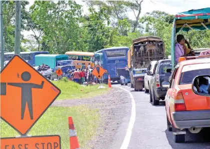  ??  ?? Vehicles wait during a traffic jam along the road on Tuesday.