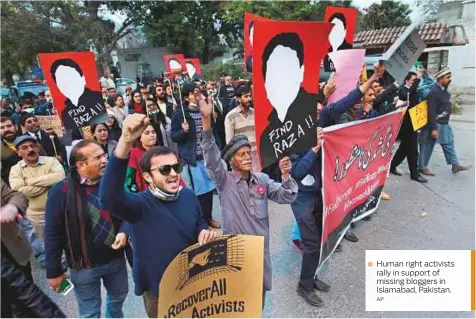  ?? AP ?? Human right activists rally in support of missing bloggers in Islamabad, Pakistan.