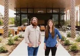  ?? ?? Winemakers Charlie Wagner and Jenny Wagner, above, co-own Caymus-Suisun with their father. Right: The Caymus-Suisun tasting room.