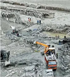  ?? PTI ?? Rescue and restoratio­n work continues at damaged Tapovan barrage, weeks after the glacier burst at Joshimath which triggered a massive flash flood, in Chamoli district of Uttarakhan­d, on Tuesday. —