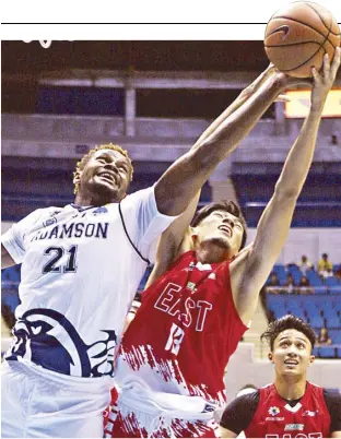  ?? JOEY MENDOZA ?? Adamson Falcon Papi Sarr and UE Red Warrior Jason Strait reach out for the rebound in a UAAP game yesterday at the Smart Araneta Coliseum.