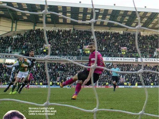  ??  ?? Heroics: Lustig’s late clearance at Hibs kept Celtic’s record intact