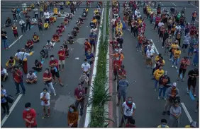  ?? (The New York Times/Jes Aznar) ?? Catholics gather in the streets Saturday near the Minor Basilica of the Black Nazarene in Manila, Philippine­s, to celebrate the Feast of the Black Nazarene. The gathering drew nearly 10,000 people and risked becoming a super spreader of the coronaviru­s in the Philippine­s, where infection numbers have been among the worst in Southeast Asia.