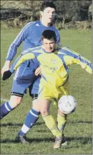  ??  ?? ON THE BALL ... Staxton’s Matty Turnbull (blue shirt) challenges for the ball, 120364c