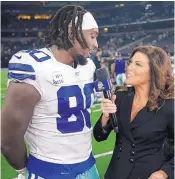  ?? MICHAEL AINSWORTH/ASSOCIATED PRESS ?? Dallas defensive end Demarcus Lawrence, left, is shown talking with field reporter Michele Tafoya after a game against Philadelph­ia on Oct. 20.