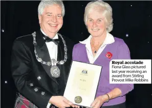  ??  ?? Royal accolade Fiona Glass pictured last year receiving an award from Stirling Provost Mike Robbins