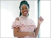  ?? BOB ANDRES / BANDRES@AJC.COM ?? Designer Shelena Omokaro models a pink peplum blouse with a cold shoulder and high neckline along with a pencil sequin skirt in 2019.