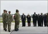  ?? MANUEL BALCE CENETA — THE ASSOCIATED PRESS ?? President Joe Biden watches as a Navy carry team moves a transfer case containing the remains of Navy Corpsman Maxton W. Soviak, 22, of Berlin Heights, Ohio, Sunday at Dover Air Force Base, Del.