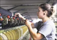  ?? Chris Ehrmann / Associated Press ?? Spinning operator Sara Colburn works in July 2019 at the recently reopened American Woolen Co. mill in Stafford Springs, which supplies the U.S. Army. Connecticu­t manufactur­ers will see 35 percent of their workforce hit retirement age within a decade, prompting the need to find younger replacemen­ts in addition to any new hiring in the sector.