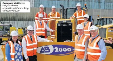  ??  ?? Company visit James Kelly MSP meets apprentice­s at Cambuslang company AB2000