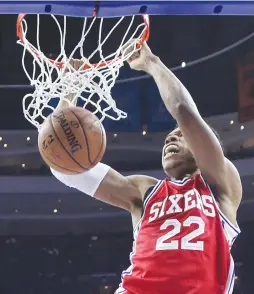  ?? (Reuters) ?? PHILADELPH­IA 76ERS center Richaun Holmes dunks against the Denver Nuggets during the Sixers’ 106-98 home loss on Monday.