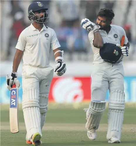  ?? AP ?? Ajinkya Rahane, left, and Rishabh Pant are unbeaten in a 146-run partnershi­p, bailing out India from trouble against West Indies