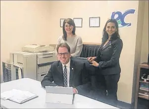  ?? SUBMITTED PHOTO ?? Provincial Policy Chair Nicole McKenna, left, PC Party Leader James Aylward and provincial executive member Melissa Handrahan review the party policy framework recently approved by the provincial executive.