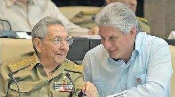  ??  ?? Cuban President Raúl Castro talks with his successor, Miguel Díaz-Canel.