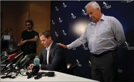  ?? REUTERS ?? FACING UP: Former Australian cricket captain Steve Smith addresses the media, as his father Peter looks on, after arriving in Sydney.