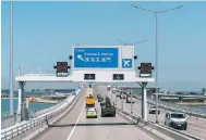  ?? Photo: Bloomberg ?? Vehicles on the Hong Kong-Zhuhai-Macau Bridge.