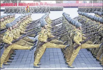  ?? WONG MAYE-E PHOTOS / AP ?? North Korean soldiers parade on Kim Il Sung Square on Saturday in Pyongyang, North Korea. North Korean leader Kim Jong Un declared Saturday that his country was ready to stand up to any threat posed by the U.S.