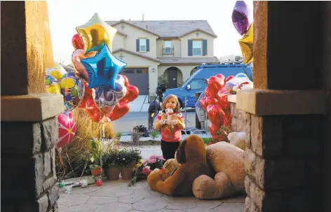  ?? Damian Dovarganes / Associated Press ?? Three-year-old Rilee Unger leaves a toy Thursday at the home in Perris (Riverside County) where 13 siblings were allegedly abused.