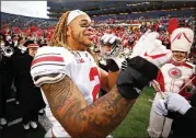  ?? GREGORY SHAMUS / GETTY IMAGES ?? Ohio State’s Chase Young celebrates a win over Michigan on Saturday. As things stand now, the Falcons could miss out on drafting Young.