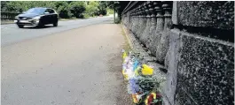  ??  ?? Floral tributes near the Merthyr Mawr junction on the A48 after the tragedy in July last year