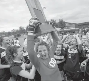  ?? NWA Democrat-Gazette/JASON IVESTER ?? Little Rock Christian goal keeper Olivia Allen hoists the trophy with her teammates following the Warriors’ 2-1 victory in the Class 5A girls soccer final Friday.