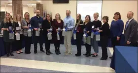  ?? EVAN BRANDT — MEDIANEWS GROUP ?? Thirteen Pottstown School District teachers are recognized for having fostered three or more years of consistent test score growth in their classrooms during the Jan. 16 school board meeting.