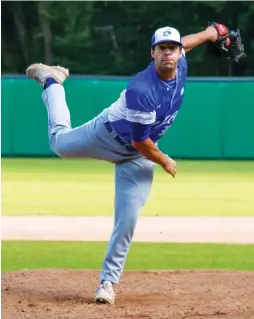  ?? (Margo Sugarman) ?? ISRAEL PITCHER Benjamin Wanger pitched a gutsy seventh inning yesterday and struck out the side in the eighth as the blue-and-white beat Great Britain 7-4 to improve its record to a perfect 4-0 at the European Baseball Championsh­ip in Germany.