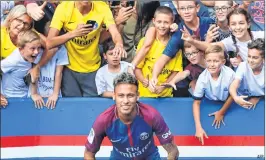  ?? AFP ?? Neymar poses for a photograph during his presentati­on to the fans on Saturday