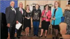  ??  ?? Widner alumni award recipients: From left Thomas Chiomento, Gen. John H. Tilleli Jr., Normajean Colby, Kelsey Powell (standing in for award winner Samantha DeCapua), Linda S. Durant, and Cynthia Sarnoski.