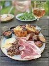  ?? WENDELL BROCK FOR THE ATLANTA JOURNALCON­STITUTION ?? Baffi’s antipasti plate includes smoked Italian sausage, prosciutto, cheese, candied pecans, caponata, toasted focaccia and more.