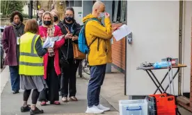  ?? London. Photograph: Guy Bell/Rex/Shuttersto­ck ?? ‘Epidemics of rapidly transmitti­ng viruses are not kind to overstretc­hed healthcare systems.’ A queue for booster jabs, Belsize Park,