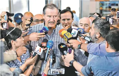  ?? ANDRES MARTINEZ/REUTERS ?? La consulta, “la ruta al fin” del gobierno de Maduro, afirmó Vicente Fox en la capital del país latinoamer­icano.