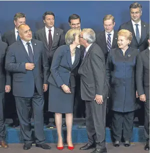  ?? Picture: Jack Taylor. ?? Theresa May is greeted by Jean-Claude Juncker, president of the European Commission, at the EU summit in Brussels.