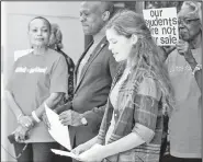  ?? Arkansas Democrat-Gazette/MITCHELL PE MASILUN ?? State Sen. Joyce Elliott (from left), D-Little Rock, and writer/activist Vincent Tolliver listen to Maggie Collins, an eighth-grader at Little Rock’s Horace Mann Middle School, during a news conference Thursday by Grassroots Arkansas.