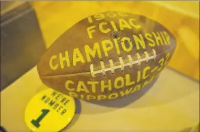  ?? Jason Rearick / Hearst Connecticu­t Media ?? The game ball of the first FCIAC championsh­ip in 1966 is shown on display at the Stamford Historical Society. Stamford Catholic beat Rippowam, 32-6.