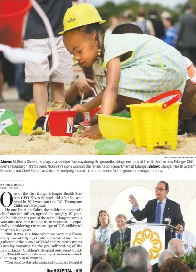  ?? STAFF PHOTOS BY ERIN O. SMITH ?? Above: McKinley Dickens, 4, plays in a sandbox Tuesday during the groundbrea­king ceremony at the site for the new Erlanger Children’s Hospital on Third Street. McKinley’s mom works in the rehabilita­tion department at Erlanger. Below: Erlanger Health...