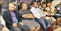  ??  ?? ANXIOUS: Relatives of five KZN residents who died in the church tragedy wait at King Shaka Internatio­nal Airport for their remains to arrive yesterday.