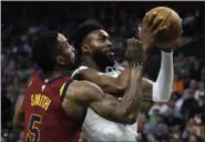  ?? CHARLES KRUPA — THE ASSOCIATED PRESS ?? Celtics guard Jaylen Brown tries to drive against J.R. Smith