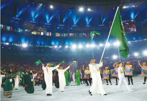  ??  ?? THE SAUDI ARABIAN delegation arrives at the Olympic opening ceremony in Brazil.