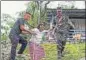  ?? ?? A senior citizen being assisted outside a polling booth in Alipurduar on Friday.