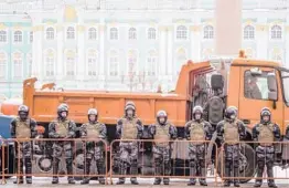  ?? DMITRI LOVETSKY/AP ?? Russian National Guard soldiers block the entrance Saturday to Palace Square before Sunday’s protest in St. Petersburg, Russia.