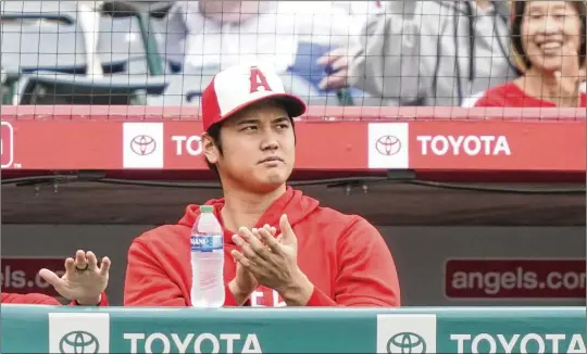  ?? RYAN SUN/ASSOCIATED PRESS ?? The Los Angeles Angels’ Shohei Ohtani, who is probably going to the open market after another stellar season with the Angels, watches Sept. 17 from the dugout during a game against the Detroit Tigers in Anaheim, Calif. Ohtani, who doesn’t turn 30 until July, had elbow surgery recently.