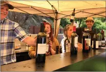  ?? PHOTO BY LAURA NESS ?? Winemaker Jim Cargill, far right, of House Family Vineyards pours wines at the library table at least year's Grand Tasting at The Mountain Winery in Saratoga. This year's Grand Tasting is set for Sunday and features wineries that have not participat­ed in the event before, including David Bruce, Mccarthy, Mchenry and Vidovich.