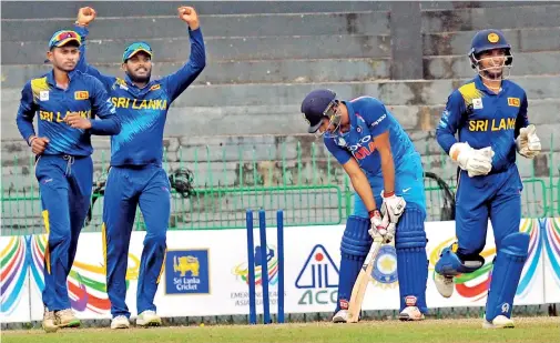  ??  ?? Himmat Singh is clean bowled by Shehan Jayasuriya. Pic by Ranjith Perera