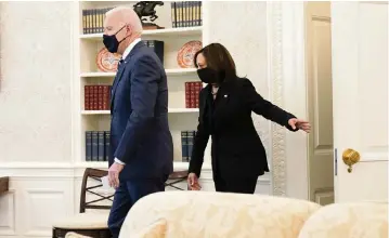  ?? ANDREW HARNIK AP ?? President Joe Biden and Vice President Kamala Harris arrive in the Oval Office of the White House on Thursday. Harris attended Howard University in Washington, D.C., and is the first HBCU graduate to be vice president.