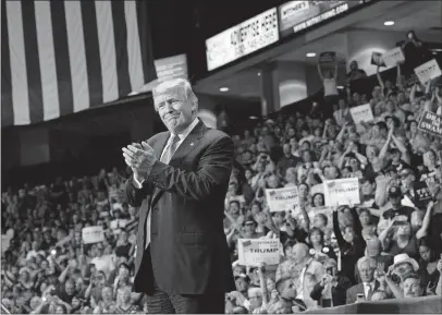  ?? [DOUG MILLS/THE NEW YORK TIMES] ?? President Donald Trump, at this rally in Youngstown in July 2017, promised that the jobs in the region’s shuttered factories “are all coming back,” and he urged those struggling: “Don’t move, don’t sell your houses.”