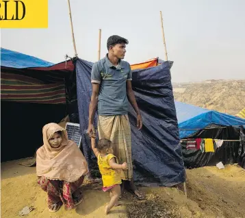  ?? MANISH SWARUP / THE ASSOCIATED PRESS ?? Rohingya Muslim refugee Mohammad Younus, 25, from the Myanmar village of Gu Dar Pyin, stands in Kutupalong refugee camp, Bangladesh. He still carries a bullet from when he was shot in an attack on his village.