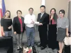  ??  ?? The Chinese Embassy turns over the humanitari­an aid in cash of P5.1 million on behalf of RCSC to Secretary General Oscar Palabyab of PRC on December 20, 2017.