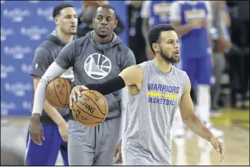  ?? MARCIO JOSE SANCHEZ / AP ?? Klay Thompson, Andre Iguodala and Stephen Curry (left to right) will attempt to avenge their defeat in last season’s NBA Finals, when they blew a 3-1 lead and enabled the Cavaliers to end Cleveland’s championsh­ip drought.