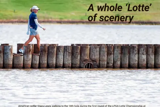  ?? — AFP ?? American golfer Stacy Lewis walking to the 14th hole during the first round of the LPGA Lotte Championsh­ip at Kapolei Golf Club in Hawaii.